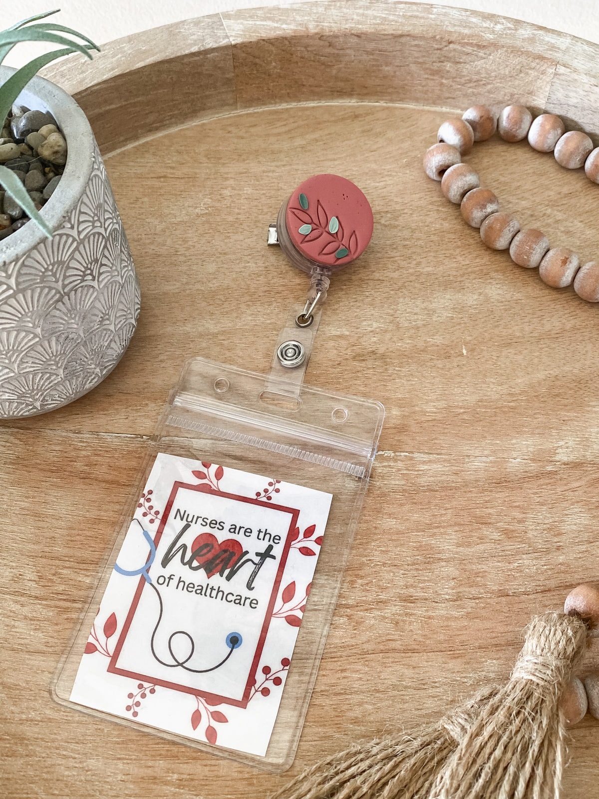 Pink floral circle handmade polymer clay badge reel