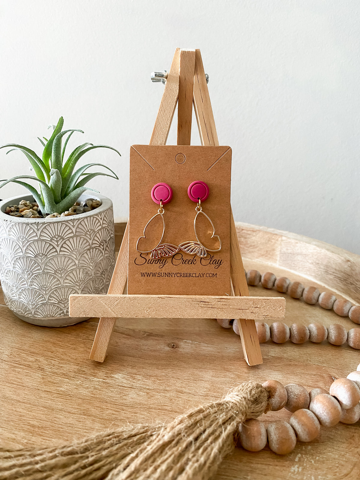 Gold butterfly dangle earrings