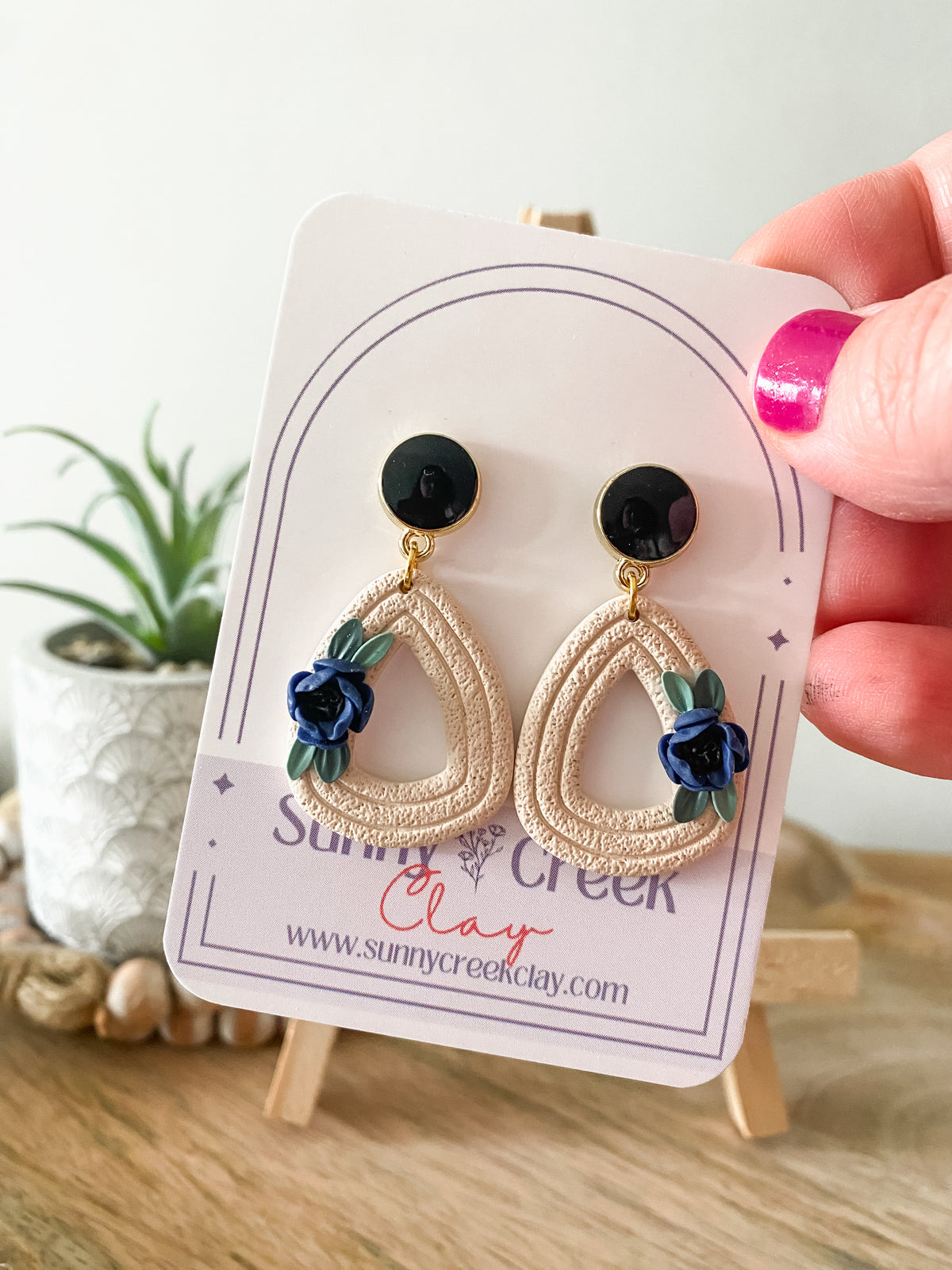 Off-white and blue handmade floral polymer clay earrings