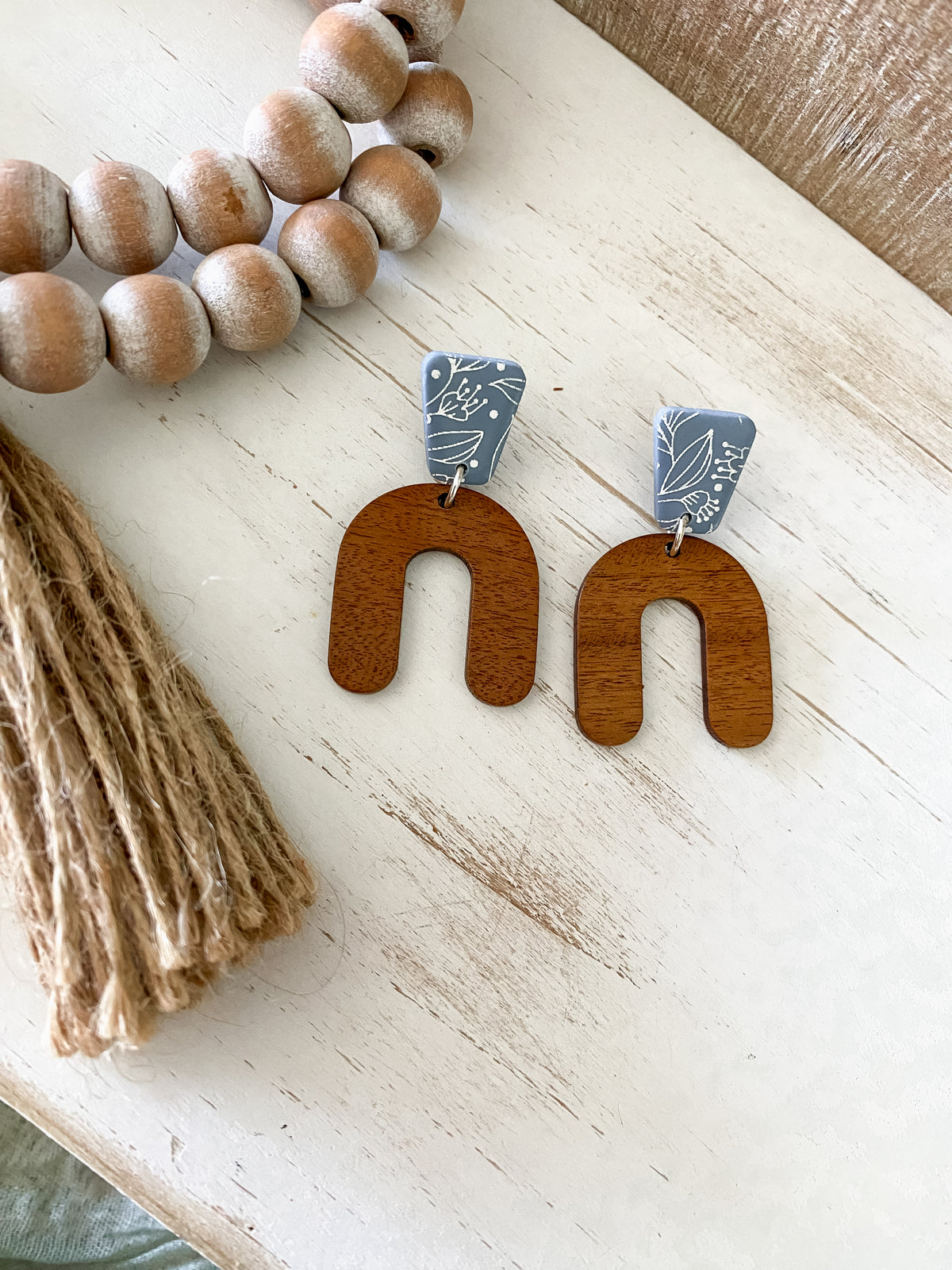 Lightweight walnut arch earring collection
