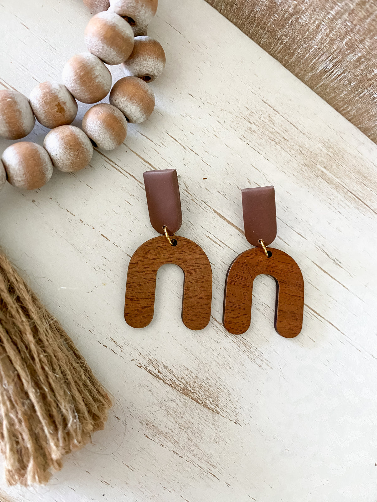 Lightweight walnut arch earring collection