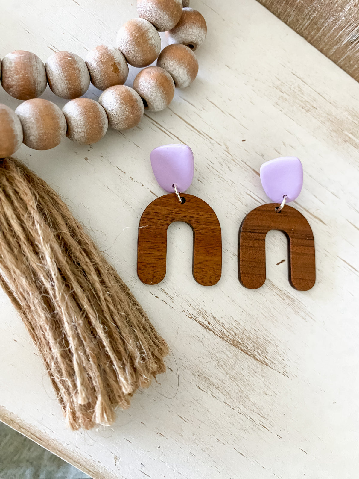 Lightweight walnut arch earring collection