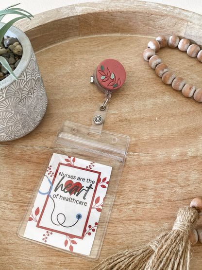 Pink floral circle handmade polymer clay badge reel