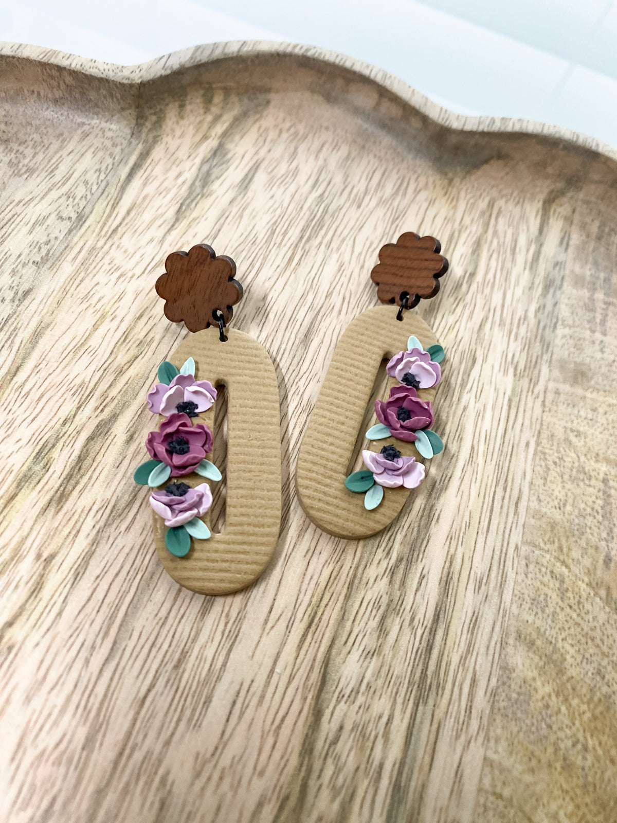 Oval tan and purple floral earrings