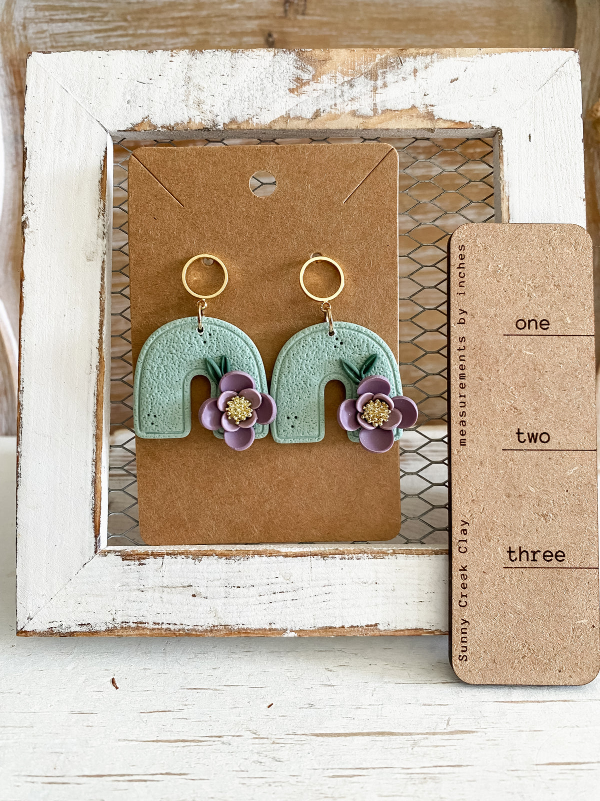 Green and purple floral arches