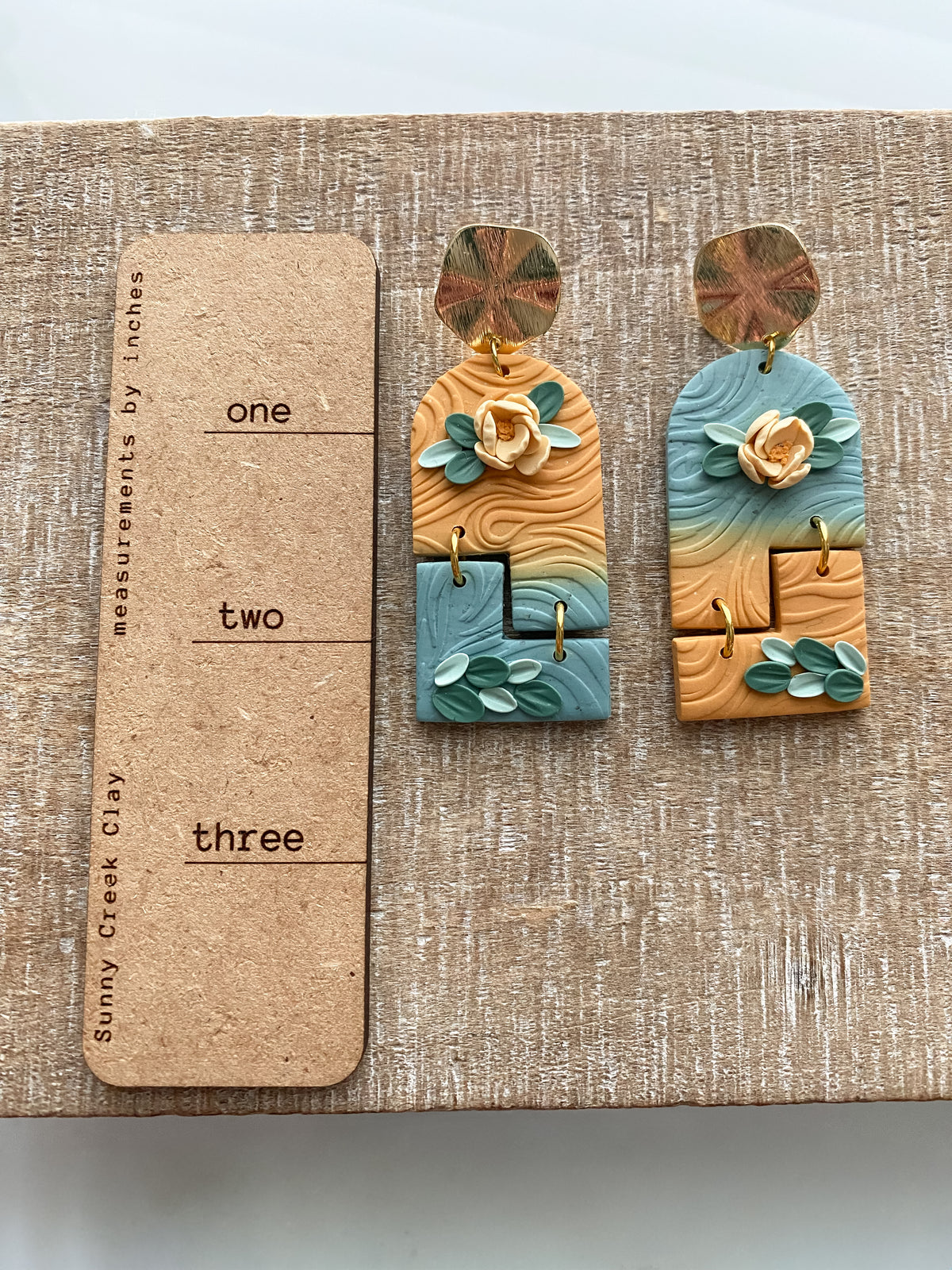 Orange and blue ombre floral interlocking earrings