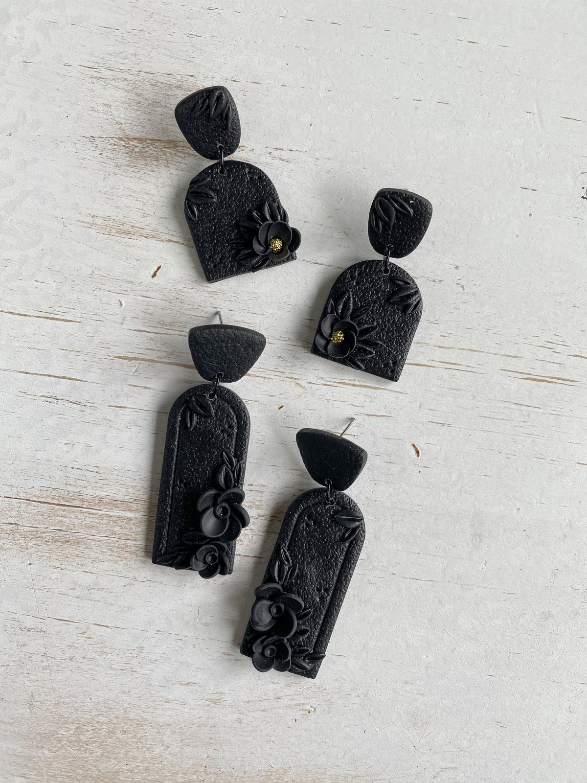 Black handmade floral polymer clay earrings