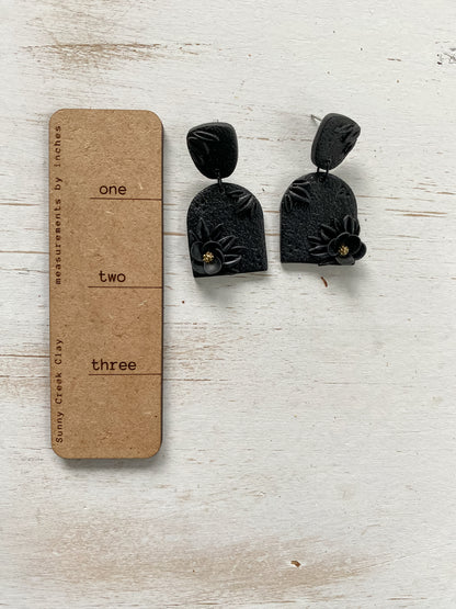 Black handmade floral polymer clay earrings