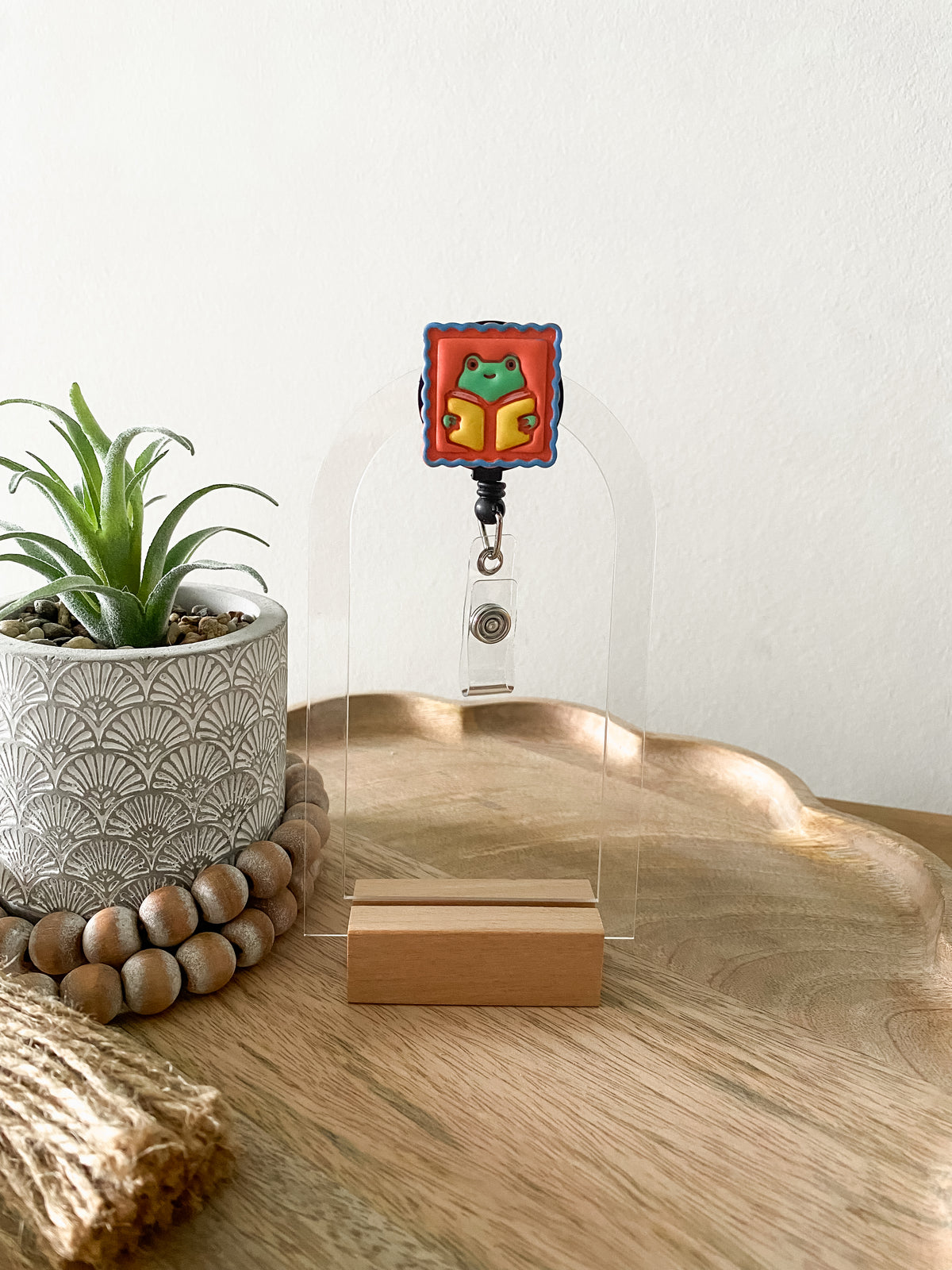 Orange bookish frog handmade polymer clay badge reel