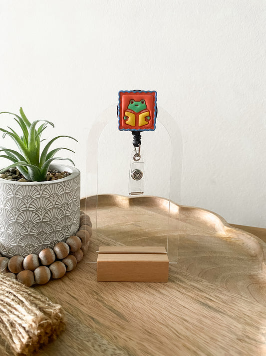 Orange bookish frog handmade polymer clay badge reel