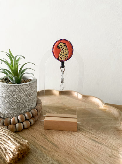 Orange cheetah handmade polymer clay badge reel