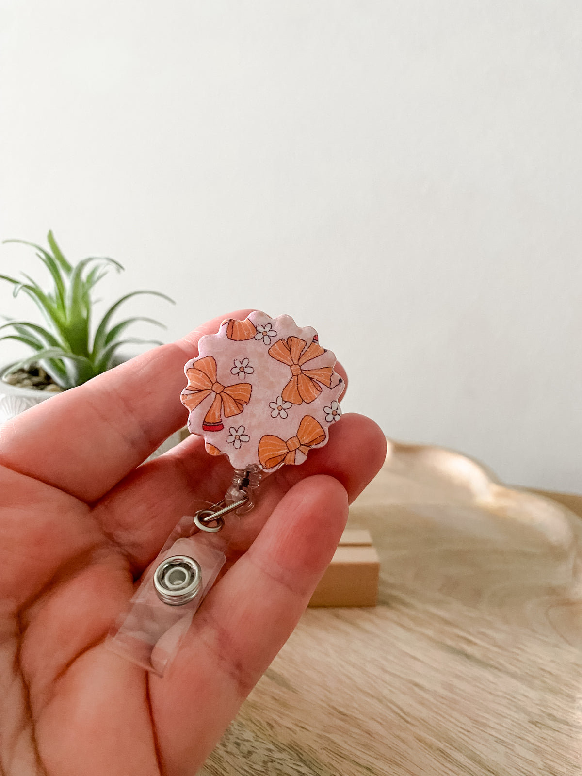 Pink pencil bow circle handmade polymer clay badge reel