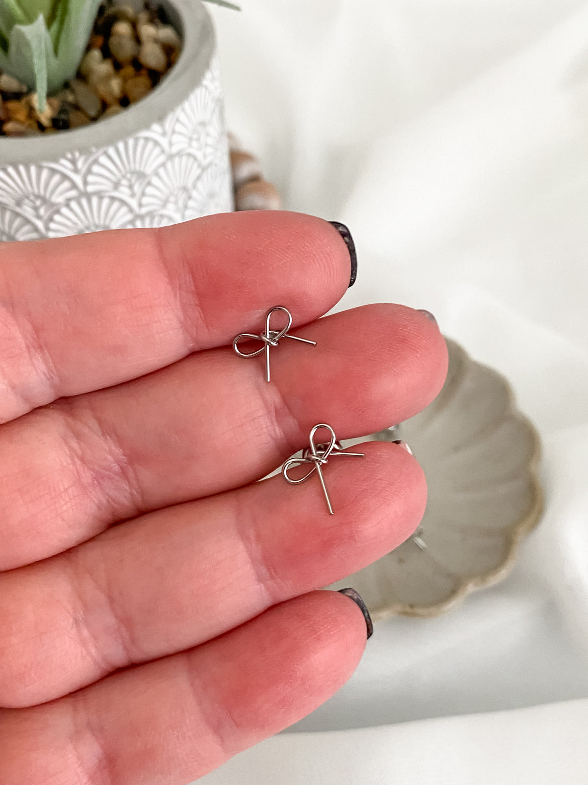 Silver stainless steel mini bow stud earrings