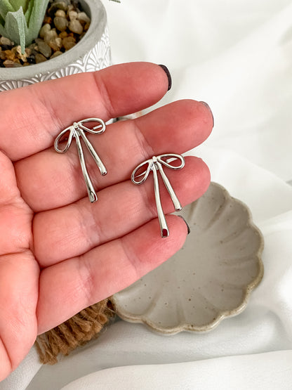 Platinum plated solid bow stud earrings