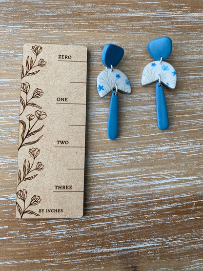 White and blue floral dangle earrings