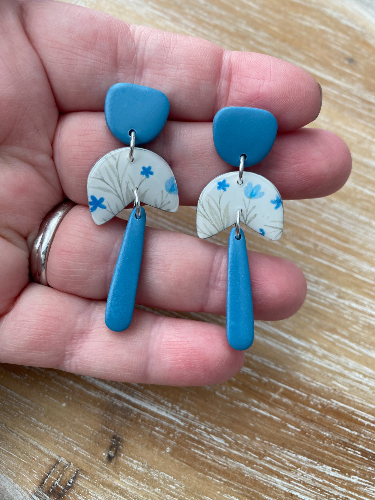 White and blue floral dangle earrings