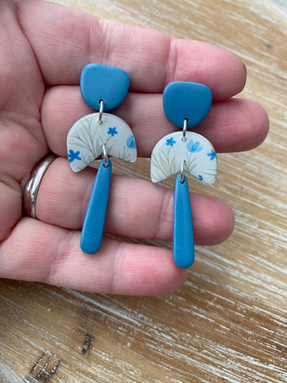 White and blue floral dangle earrings