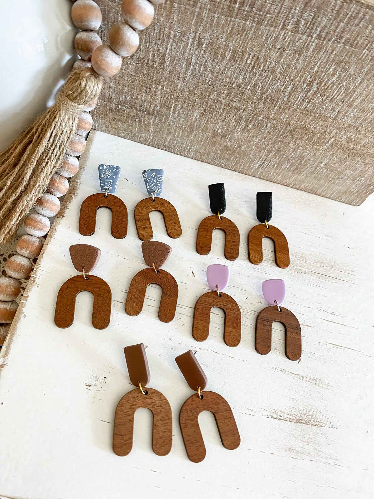 Lightweight walnut arch earring collection