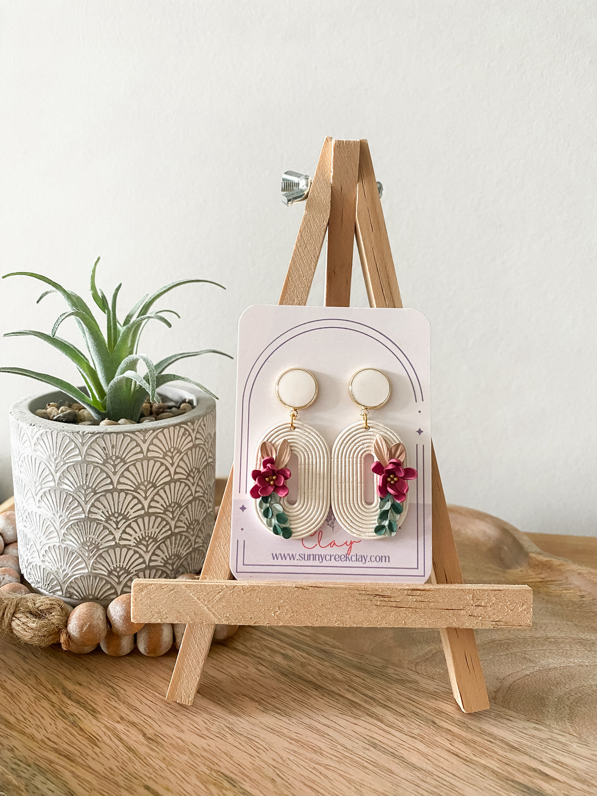 Off-white embossed handmade floral polymer clay earrings
