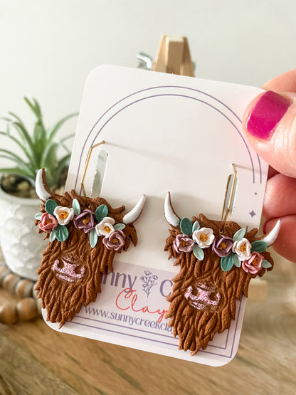 Highland cow with flower crown