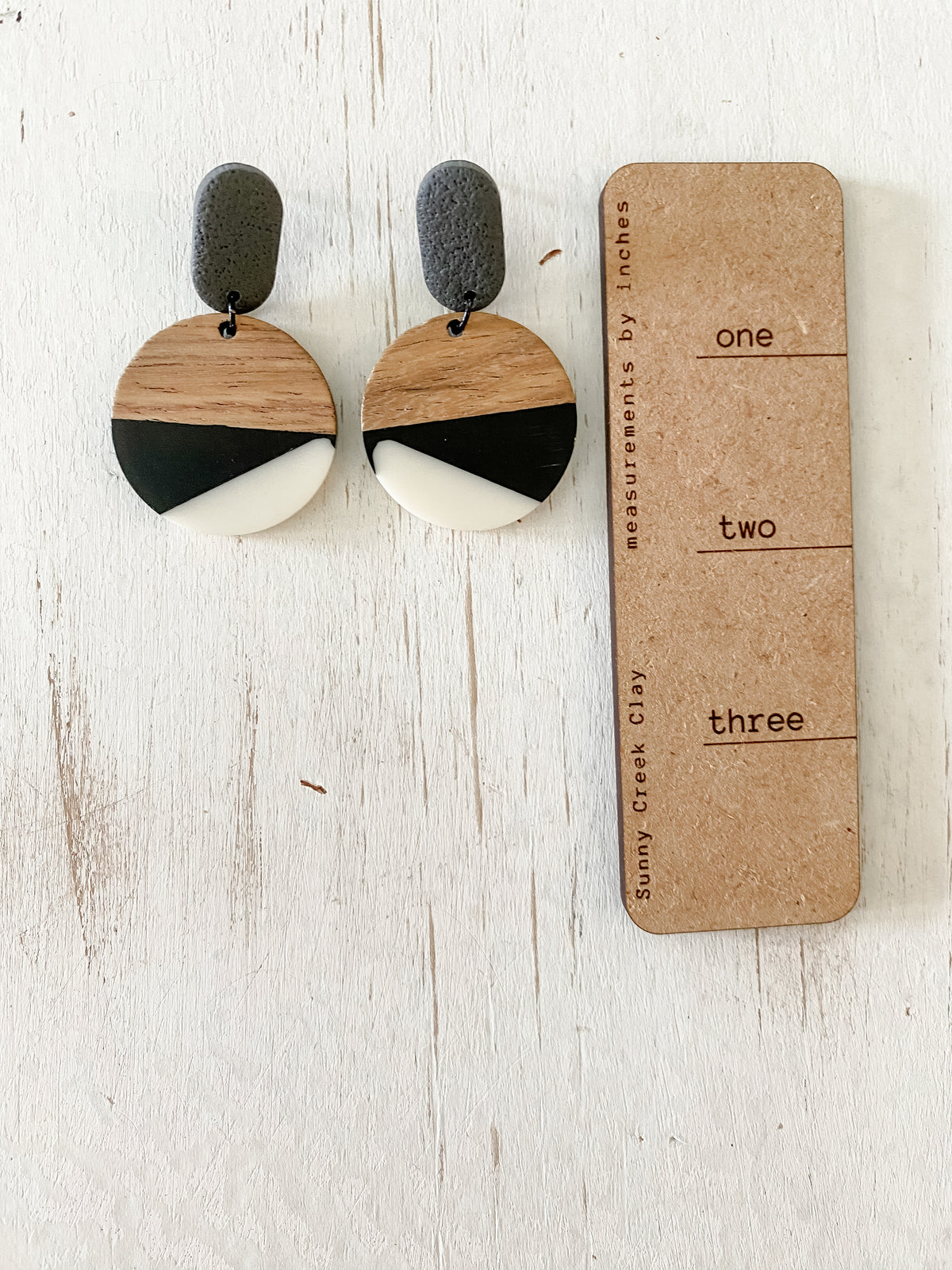 Black and white resin & walnut earring collection