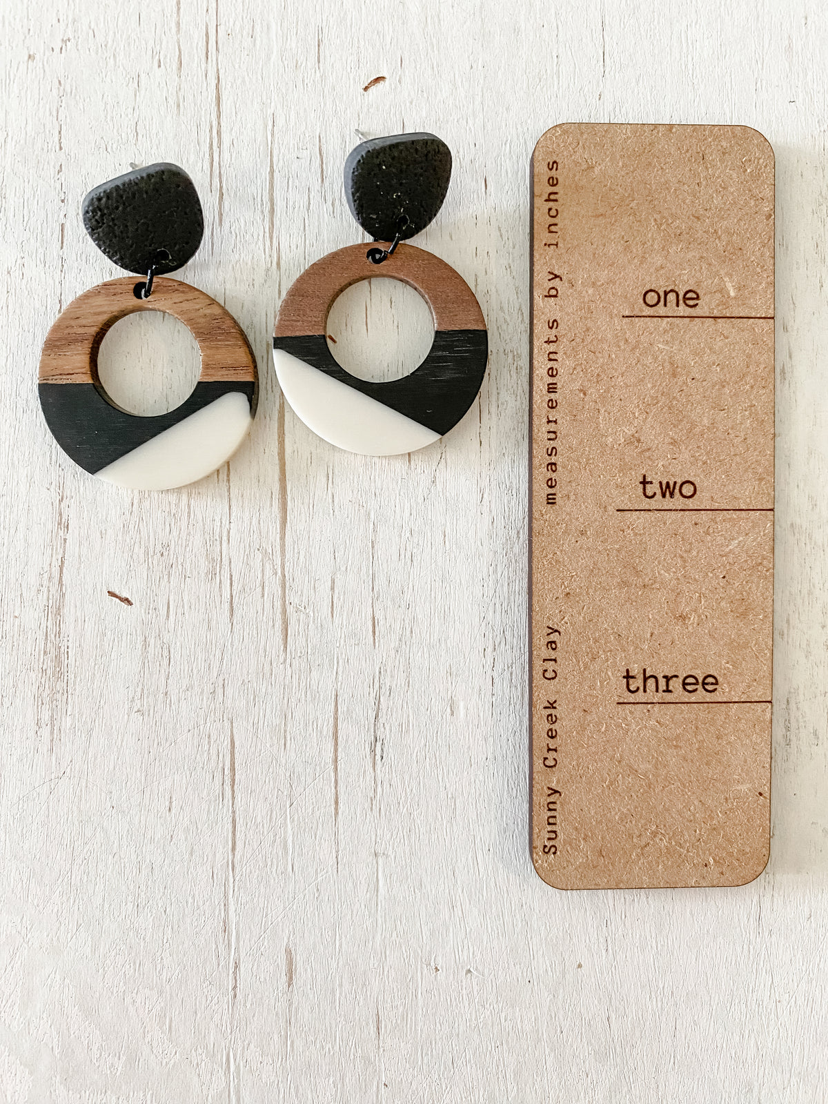 Black and white resin & walnut earring collection