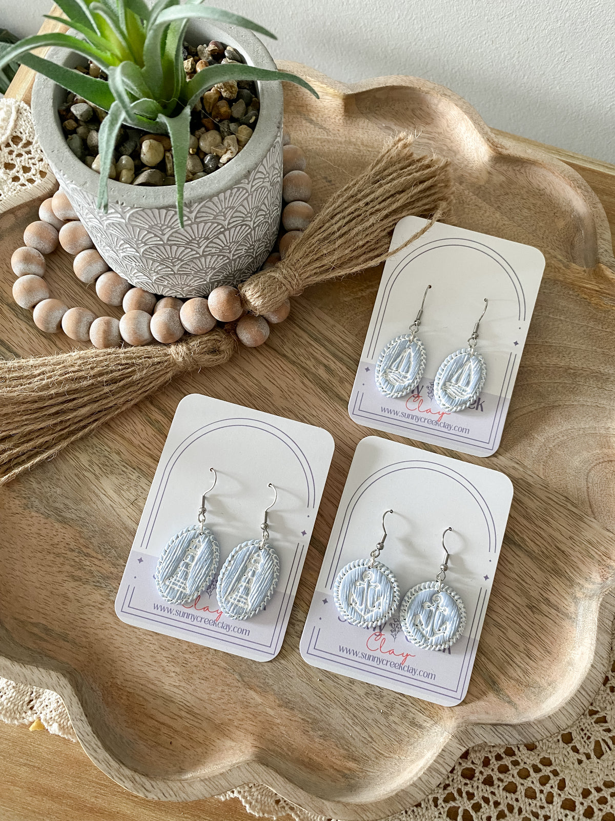 Soft blue coastal handmade polymer clay earring collection