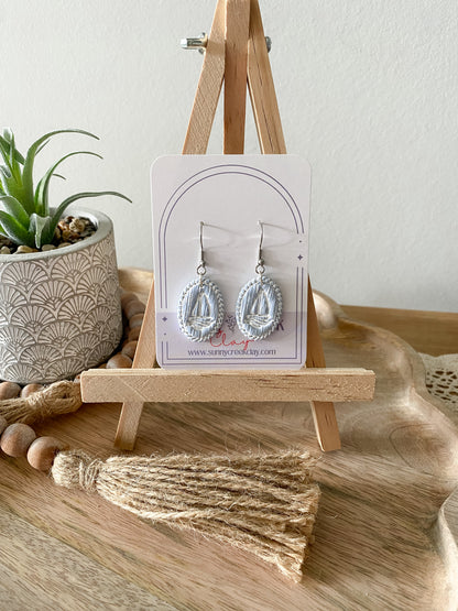 Soft blue coastal handmade polymer clay earring collection