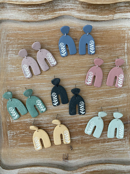 Flower imprint arch dangle earrings
