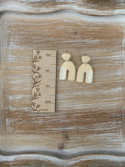 Flower imprint arch dangle earrings