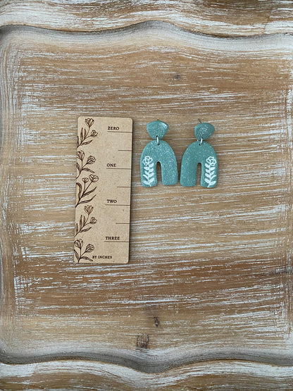 Flower imprint arch dangle earrings