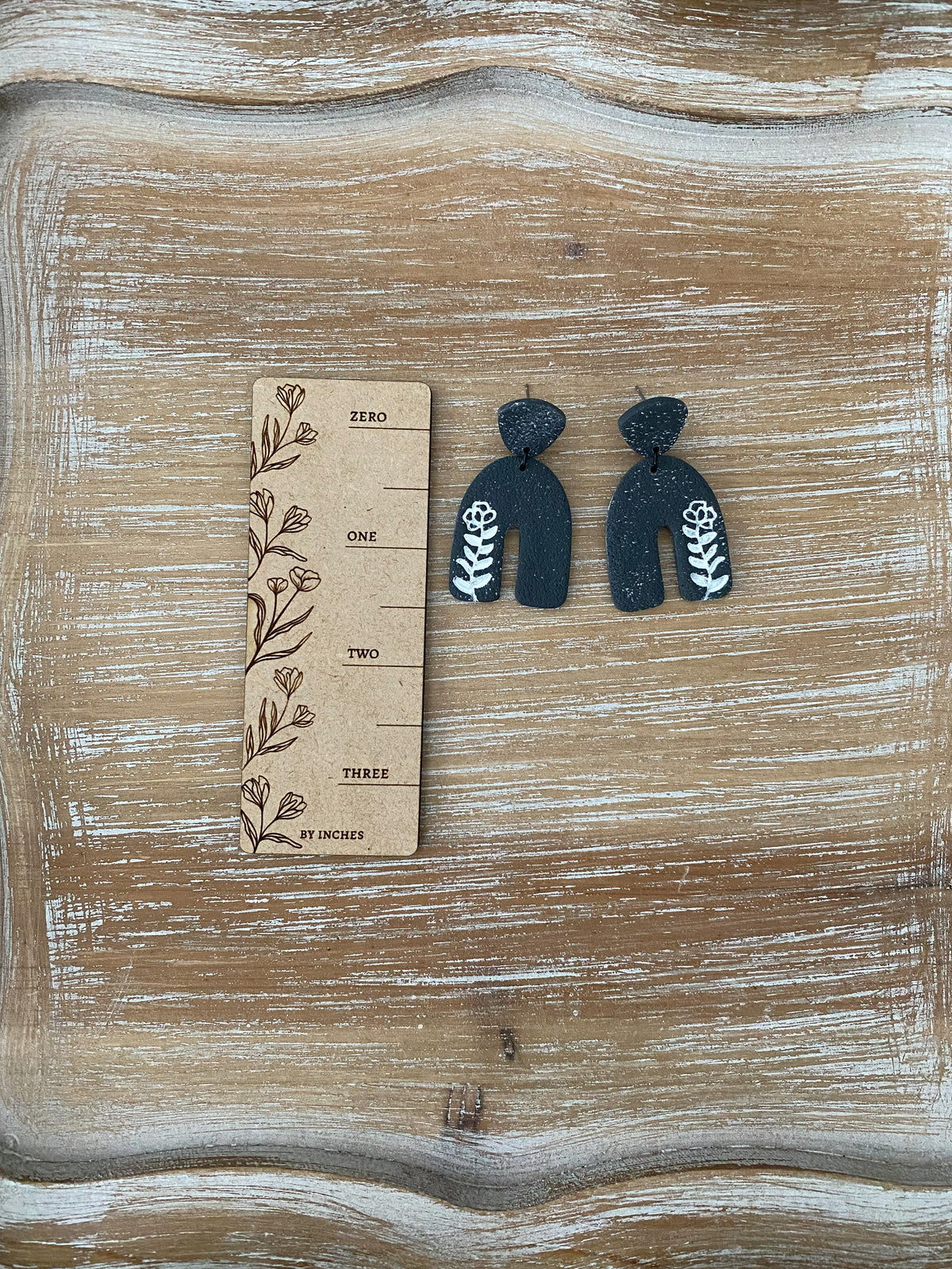 Flower imprint arch dangle earrings