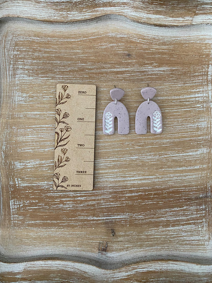 Flower imprint arch dangle earrings