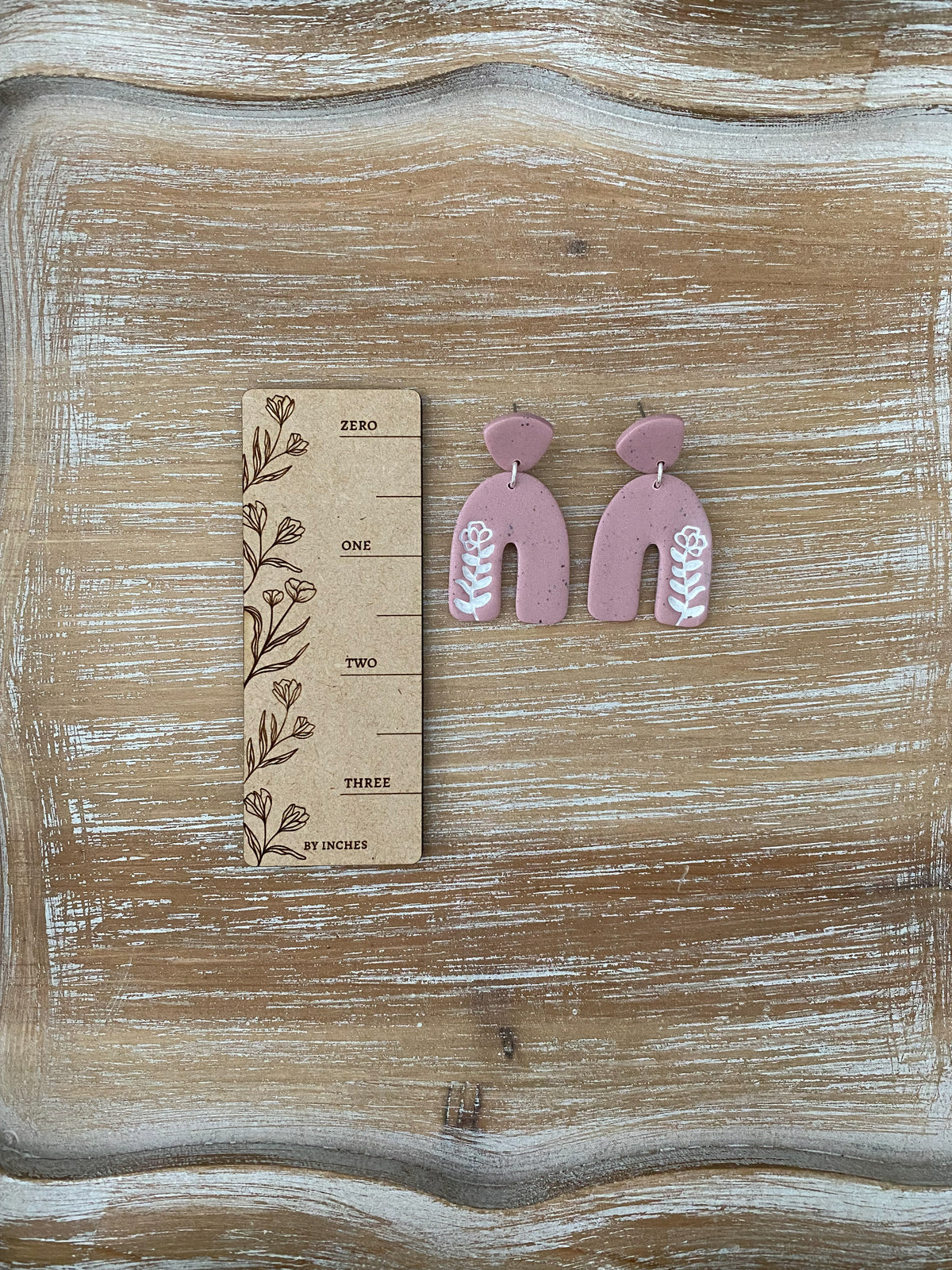 Flower imprint arch dangle earrings