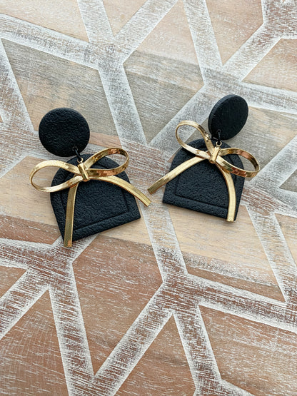 Black and gold bow arch polymer clay earrings