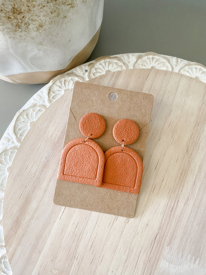 Orange handmade polymer clay earring collection