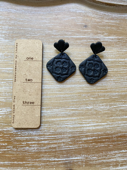 Black square floral embossed earrings