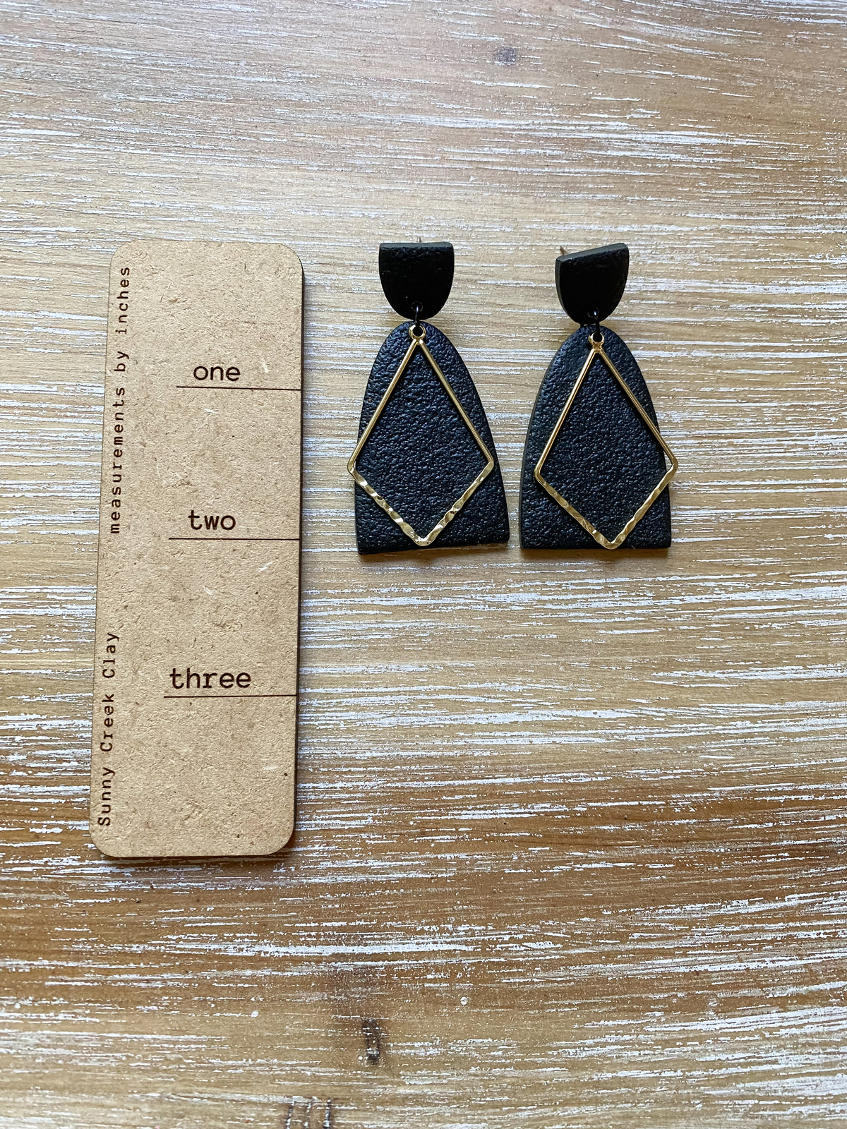 Tall black and gold polymer clay earrings