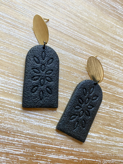 Tall black embossed arch earrings